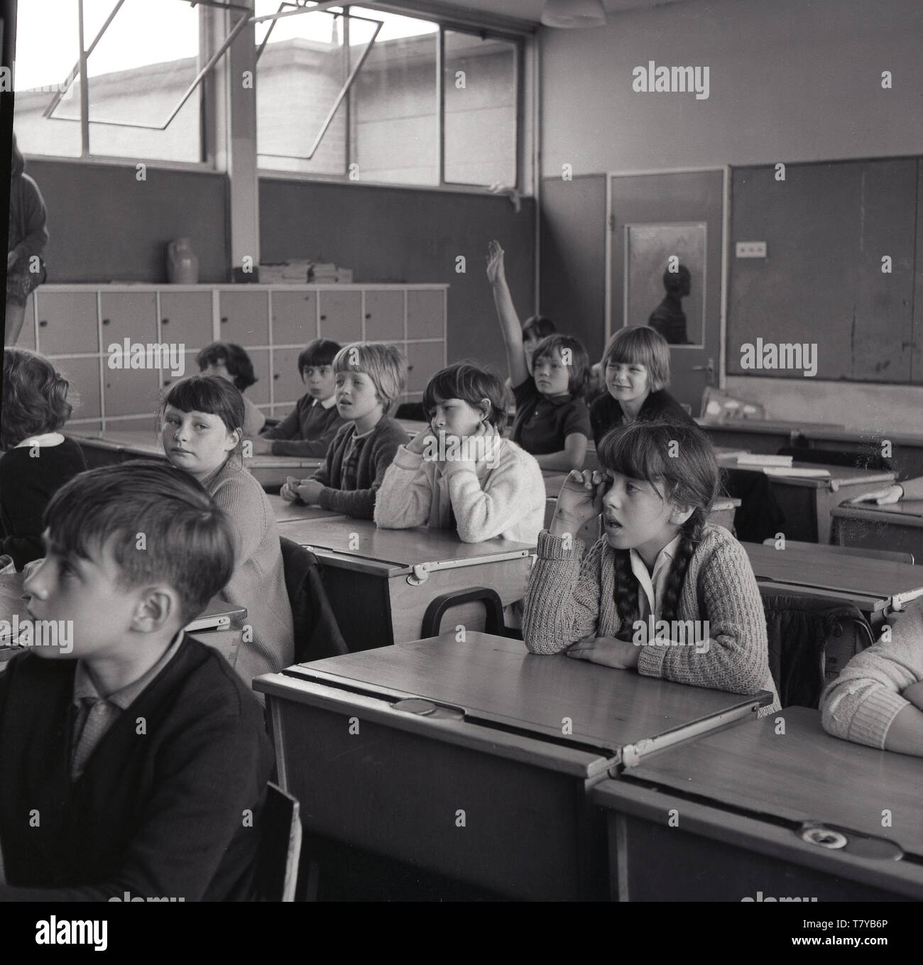 1960s, historical, children sitting at wooden desks inside a school classroom, England, UK. Stock Photo