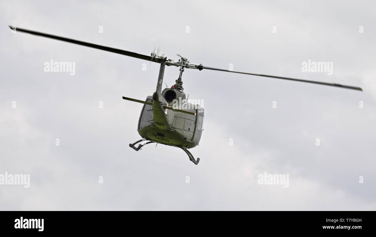 Bell UH-1 Iroquois "Huey" flying at the season premiere at Shuttleworth on the 5 May 2019 Stock Photo