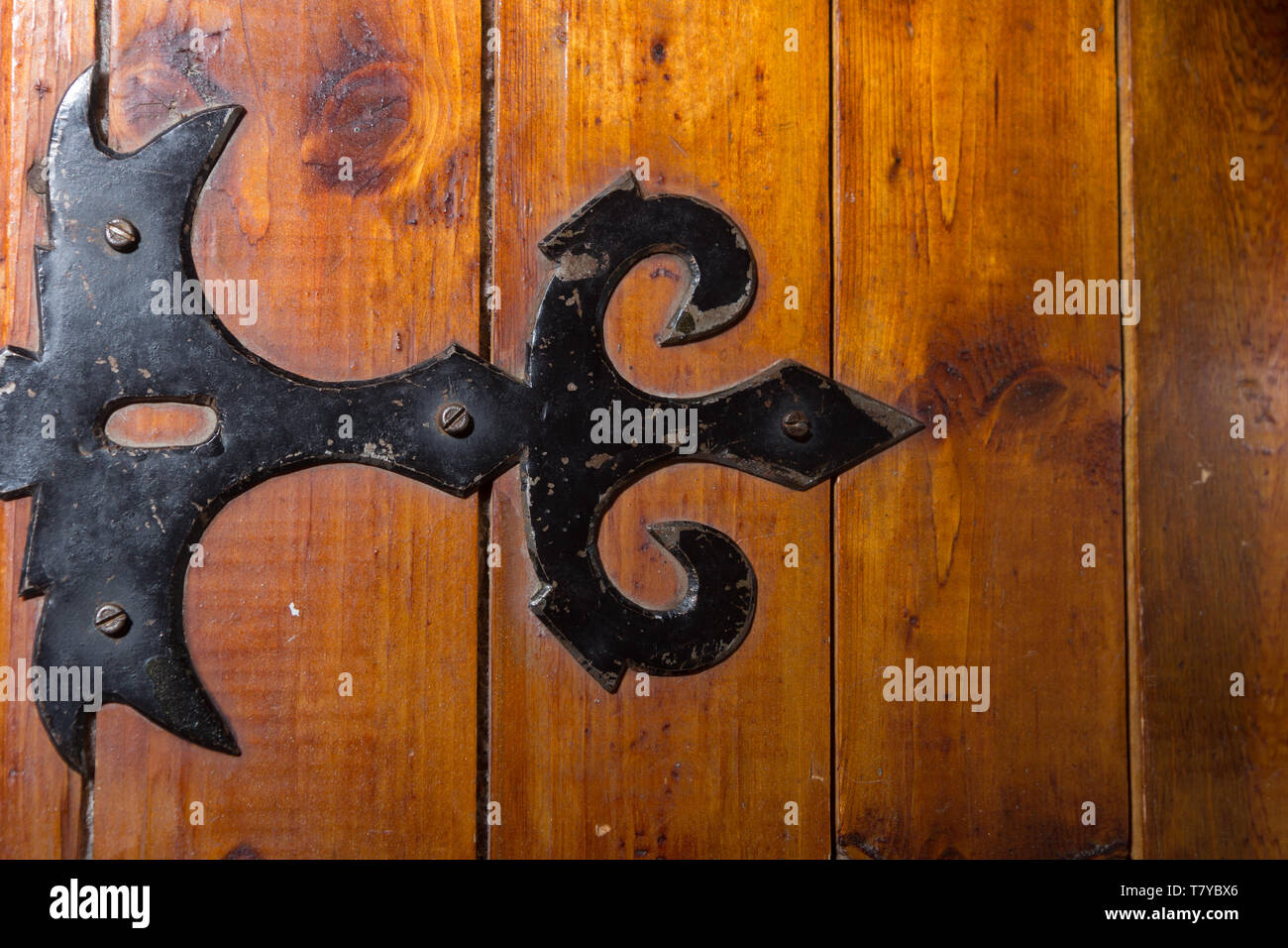 black metal handmade hinge on wooden chest Stock Photo Alamy