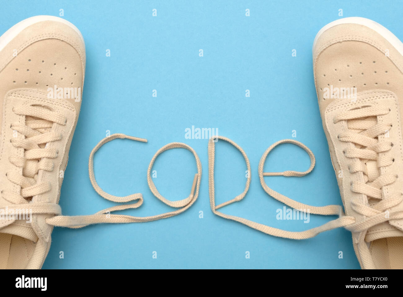 Women sneakers with laces in code text. Stock Photo