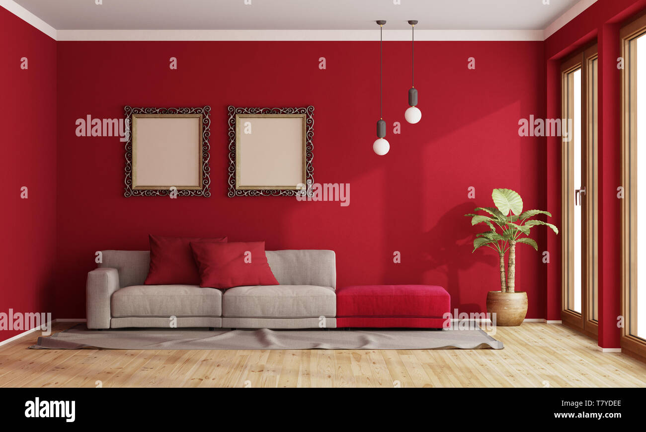Red living room with modern sofa and old frame on wall - 3d rendering Stock Photo