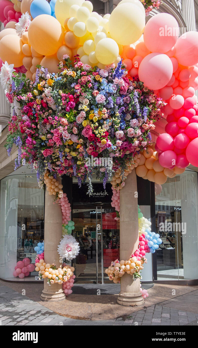 Fenwick of Bond Street London flower and balloon decorations outside the entrance Stock Photo
