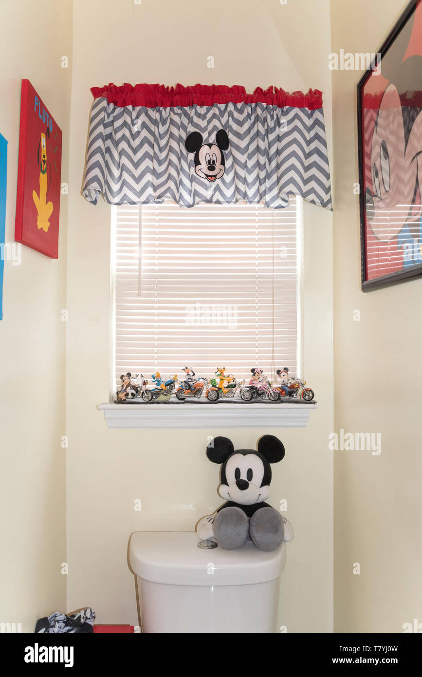 Mickey Mouse and other Disney characters decorating a bathroom. Stock Photo