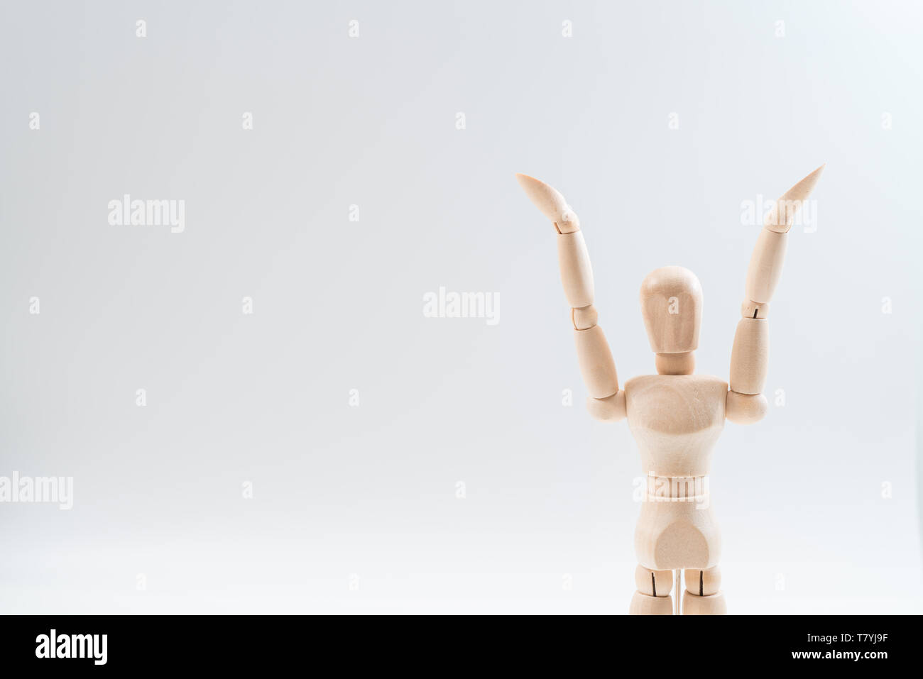 Raising Hands, Wooden dummy, Raising Hands on whiteBackground, copy space for your object or text Stock Photo