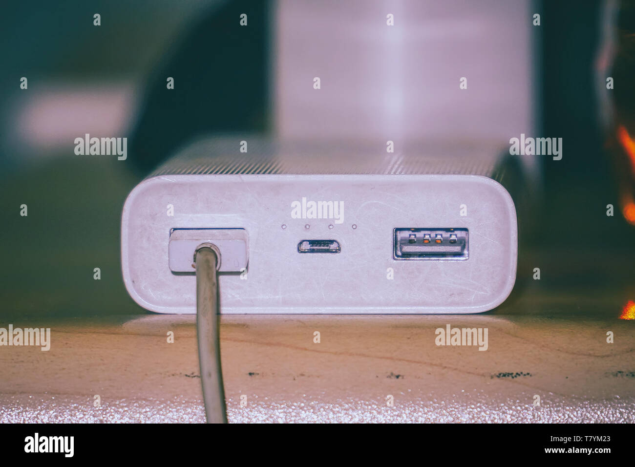 Powerbank for charging gadgets on table Stock Photo