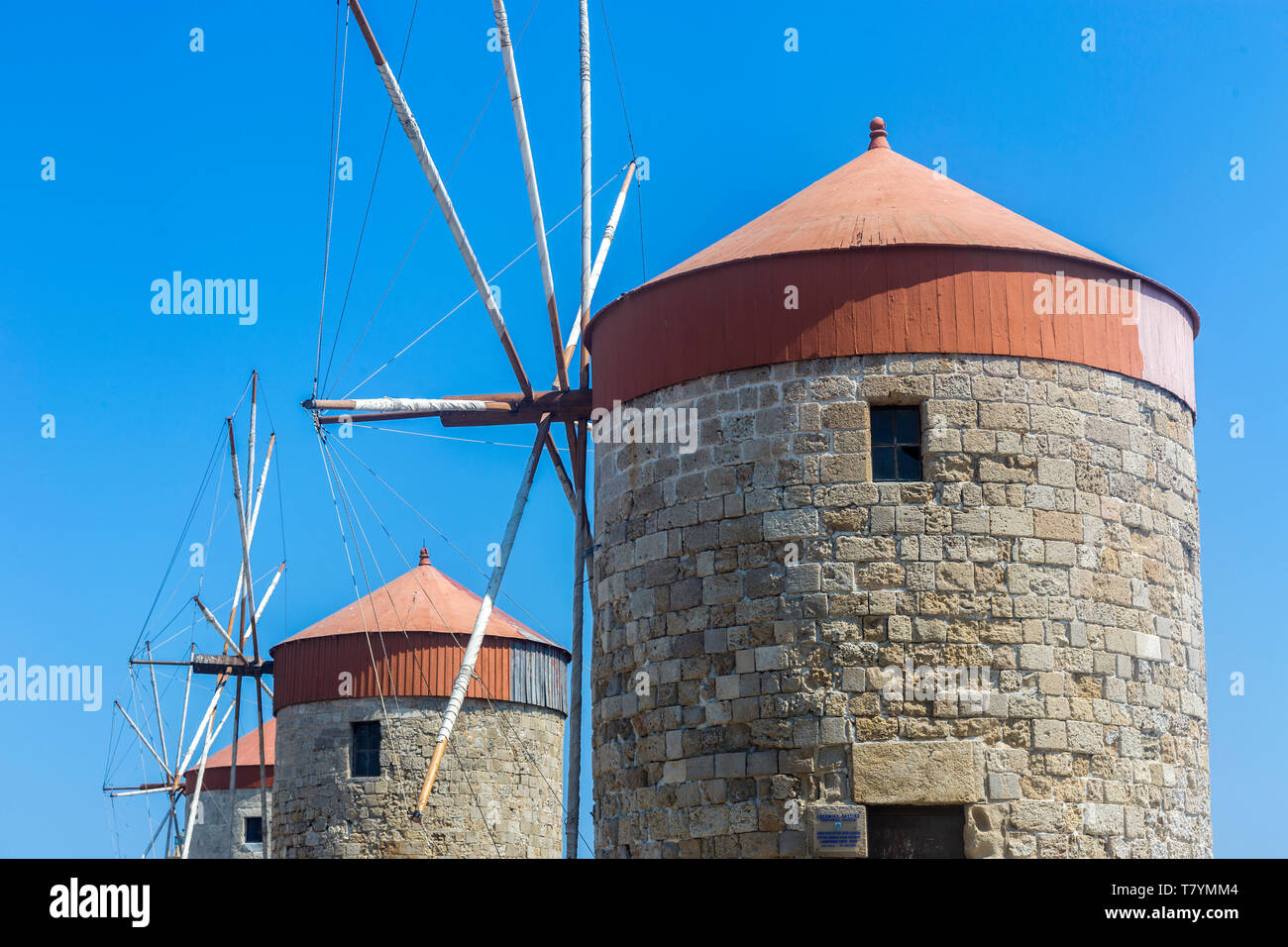 The Windmills of Mandraki Harbor. Rhodes - Greece Stock Photo