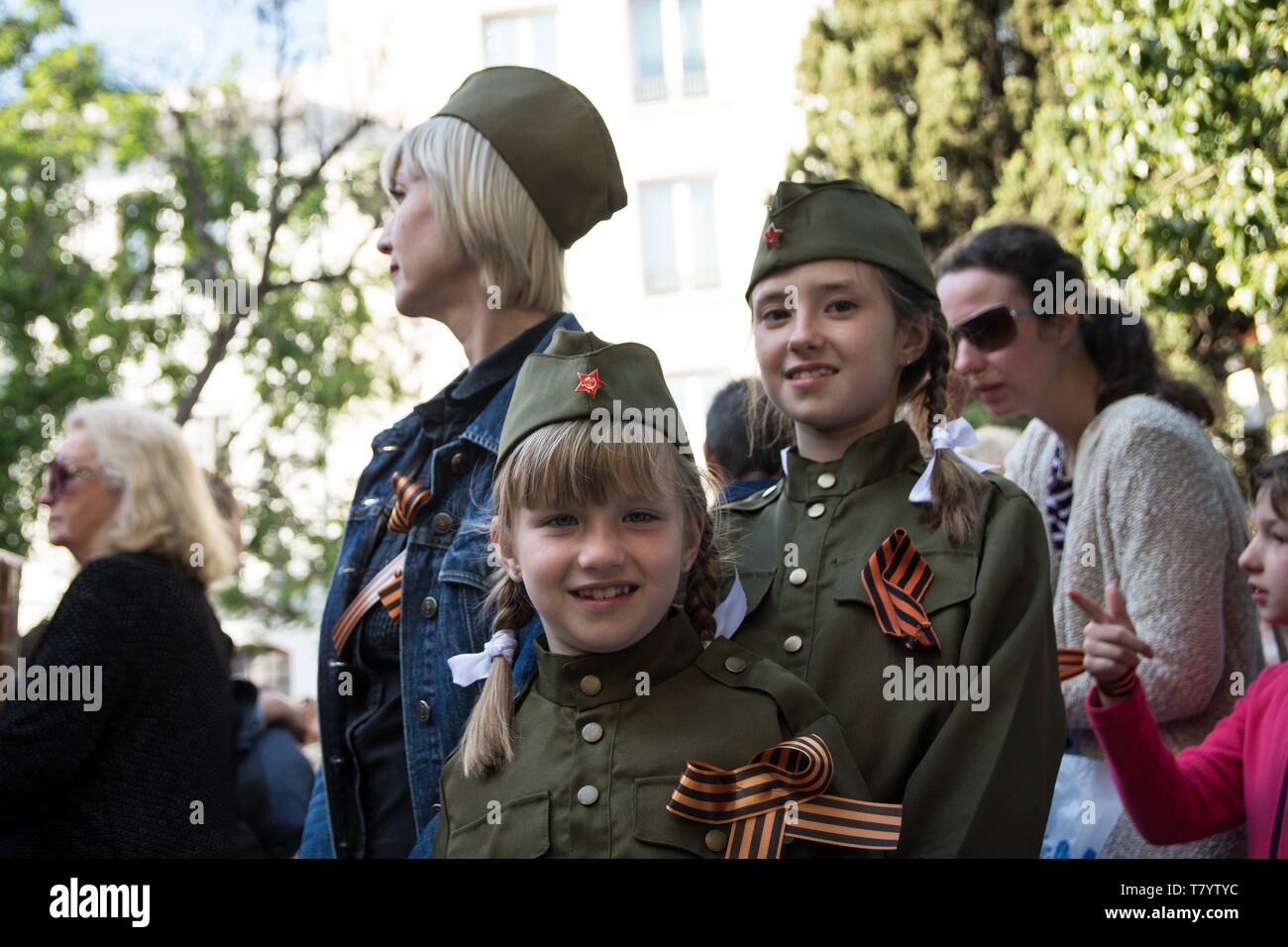Kids seen wearing uniforms during the celebrations. Thousands of Russian citizens participated in the celebrations for the anniversary of the victory against fascism, which has been established as a Victory Day. With the military parade as well as the demonstration, the festive event took place across Russia, with citizens holding photos of their relatives who have either fought or been killed during the World War. Stock Photo
