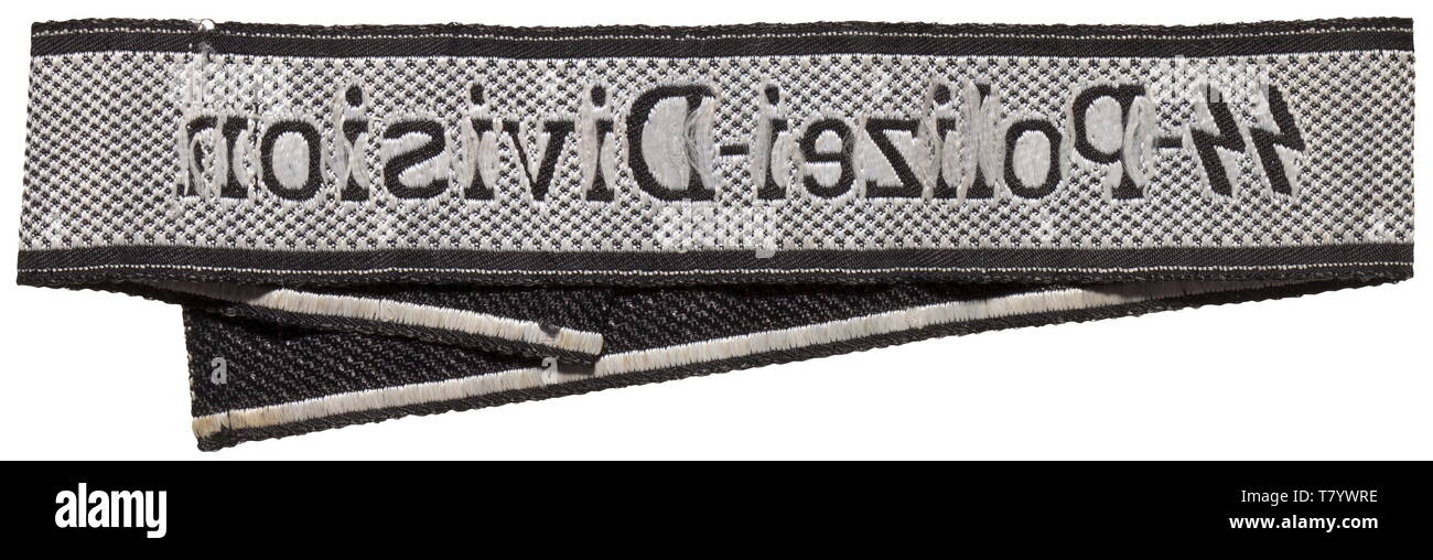 A cuff title 'SS-Polizei-Division' for enlisted men/NCOs of the 4th SS-Polizei-Panzer-Grenadier-Division, 2nd model. Black and silver-grey woven BeVo type with sewn ends and woven maker's name 'BEVO-WUPPERTAL'. Unissued, with small flaws. Length 40 cm. historic, historical, 20th century, 1930s, 1940s, Waffen-SS, armed division of the SS, armed service, armed services, NS, National Socialism, Nazism, Third Reich, German Reich, Germany, military, militaria, utensil, piece of equipment, utensils, object, objects, stills, clipping, clippings, cut out, cut-out, cut-outs, fascism, Editorial-Use-Only Stock Photo