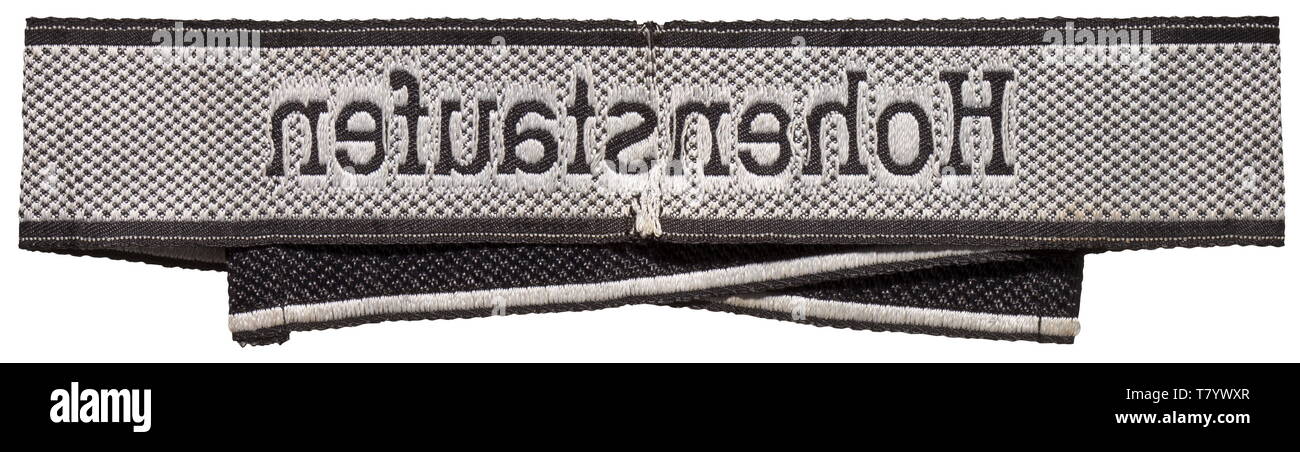 A sleeveband 'Hohenstaufen' for enlisted men/NCOs of the 9th SS-Panzer-Division. Black/silver-grey BeVo type with sewn ends. Two tears in the centre. Unissued. Length 48 cm. historic, historical, 20th century, 1930s, 1940s, secret service, security service, secret services, security services, police, armed service, armed services, NS, National Socialism, Nazism, Third Reich, German Reich, Germany, utensil, piece of equipment, utensils, object, objects, stills, clipping, clippings, cut out, cut-out, cut-outs, fascism, fascistic, National Socialist, Nazi, Nazi period, uniform, Editorial-Use-Only Stock Photo