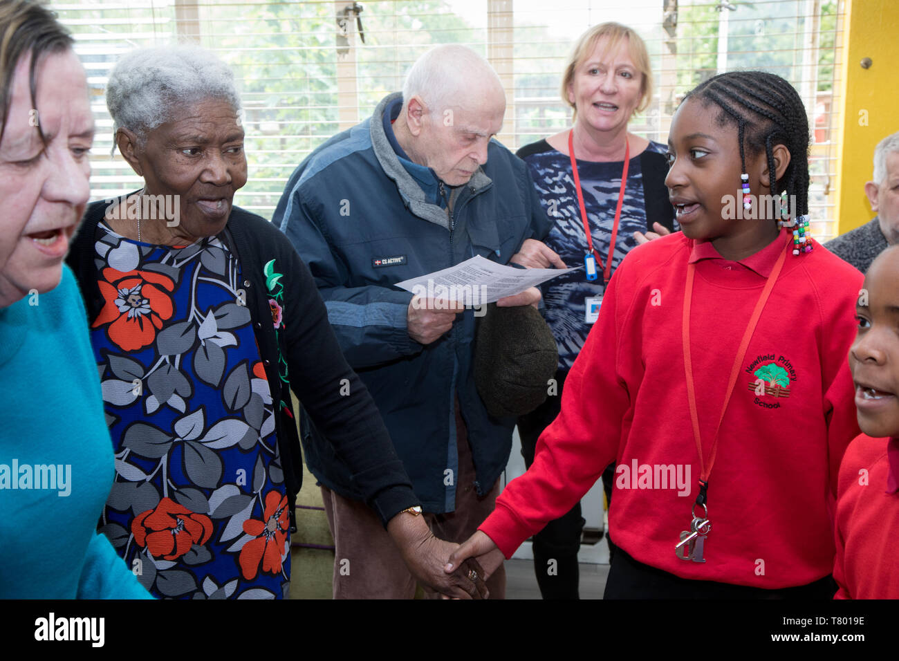 school-children-visit-a-care-home-to-sing-and-dance-with-clients-some-of-whom-are-elderly-and