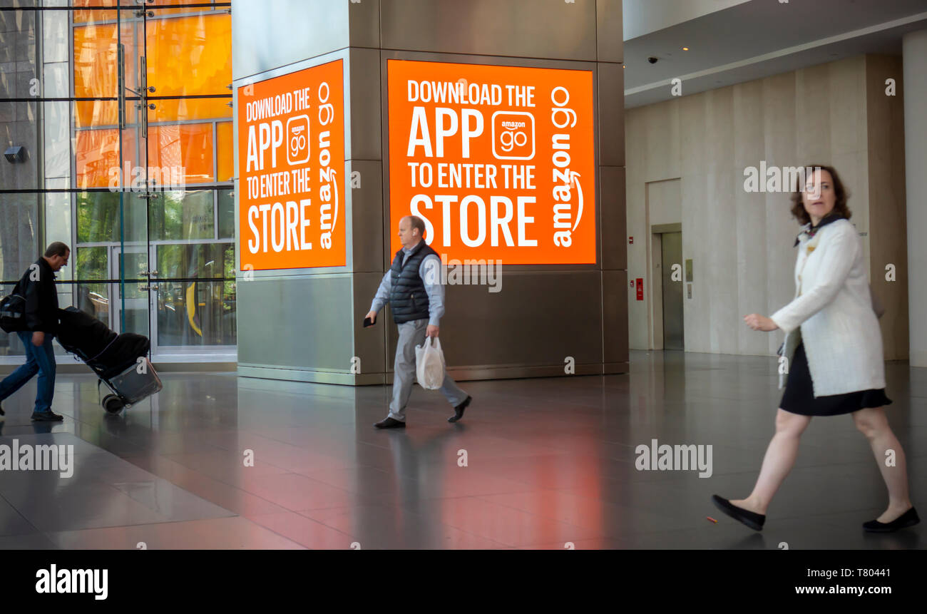 Advertising for the Amazon Go store in the Brookfield Place mall in New York on its grand opening day, Tuesday, May 7, 2019. The 1300 square-foot store, mostly stocked with prepared foods and staples, enables a shopper with the Amazon Go app to just pick up an item and walk out with Amazon â€œtrackingâ€ your purchase and charging you. In a twist from other Amazon Go stores, this one accepts cash also, after facing progressive criticism. (Â© Richard B. Levine) Stock Photo
