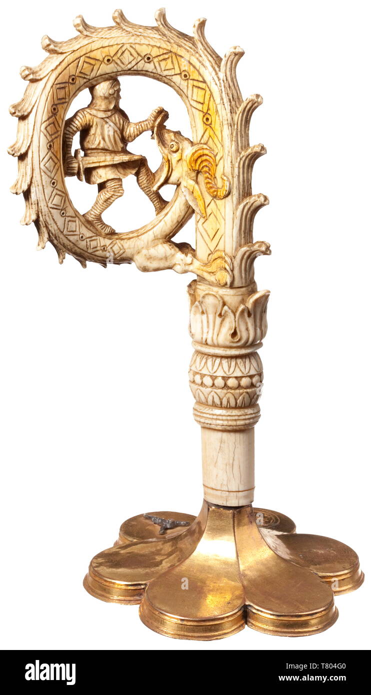 A French ivory crook Of a crozier, 19th century Semicircular and three-dimensional openwork carving depicting Saint George with dragon. The crook carved with floral and geometric patterns and screwed onto the gilt foot of a monstrance from circa 1500. Total height 28 cm. historic, historical, handicrafts, handcraft, craft, object, objects, stills, clipping, clippings, cut out, cut-out, cut-outs, Additional-Rights-Clearance-Info-Not-Available Stock Photo