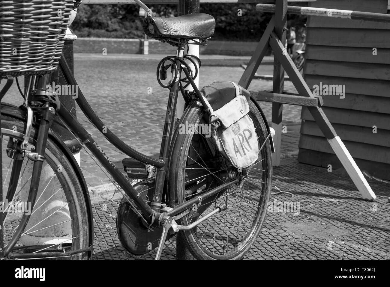 Black and white close up of ARP warden's vintage bicycle (bike) with front  basket & ARP satchel, isolated at UK heritage railway station, 1940's event  Stock Photo - Alamy
