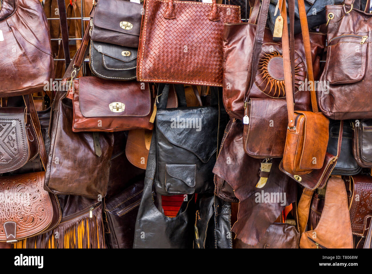 A close up of Leather handbags for sale on a market stall Stock Photo