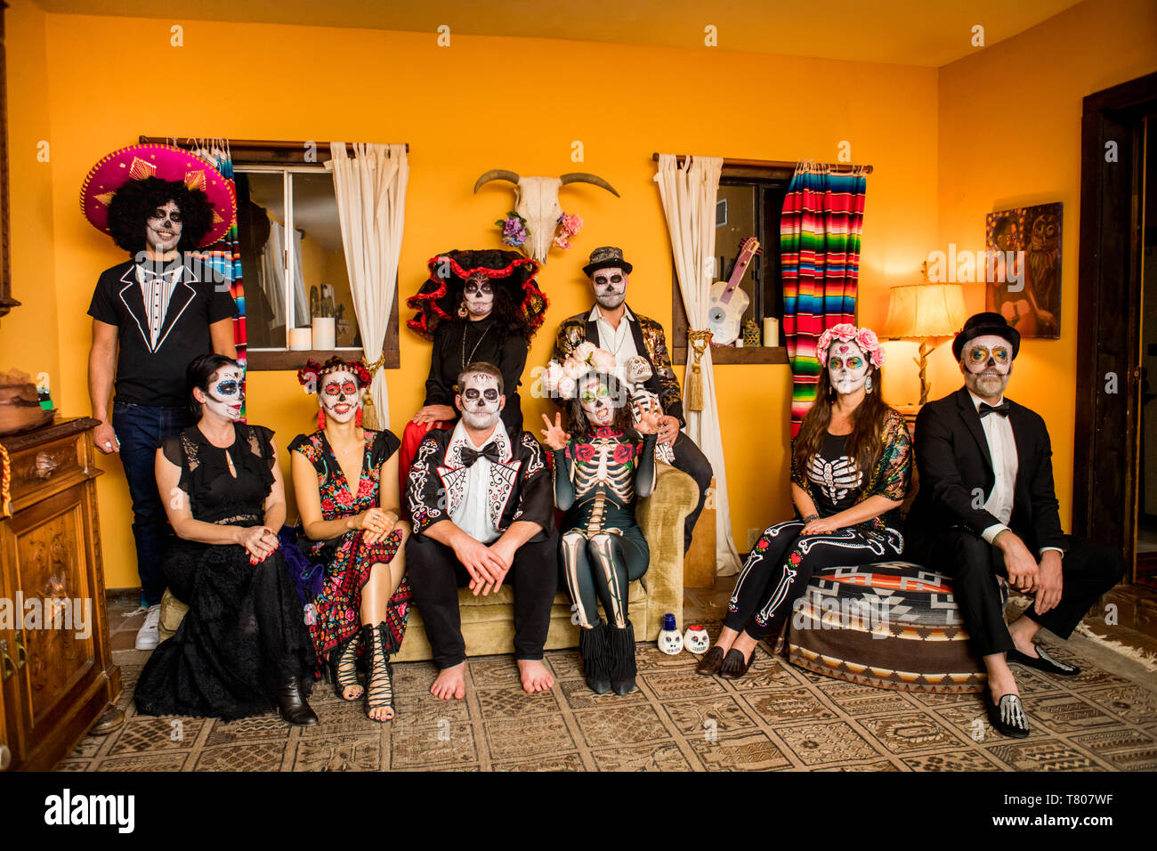 Group of friends in Dia de los Muertos makeup and costume, Day of the Dead celebration in the desert, California, USA, North America Stock Photo