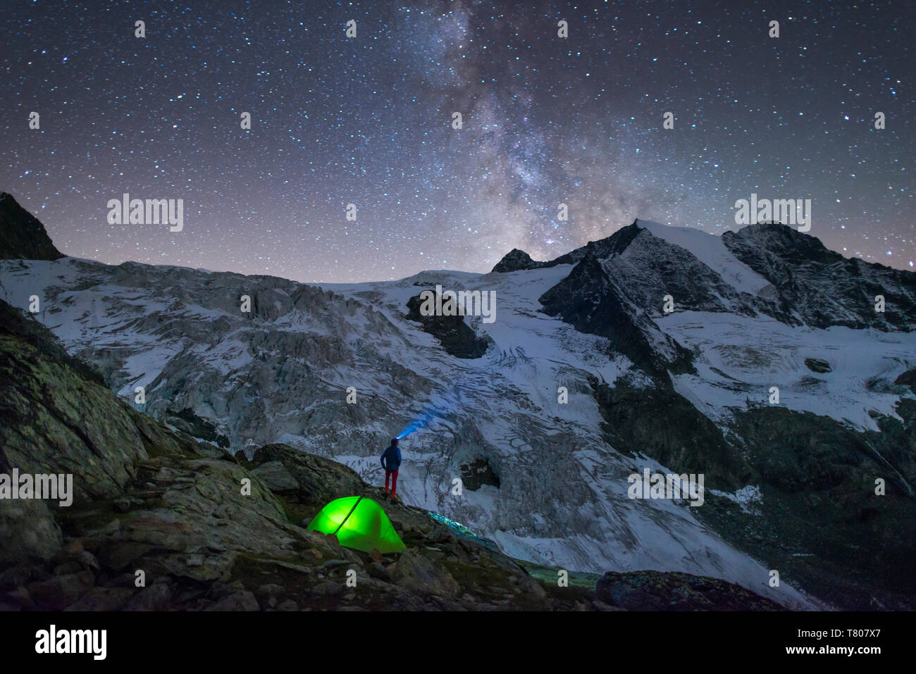 Starry sky and tent along The Walkers Haute Route from Chamonix to Zermatt, Swiss Alps, Switzerland, Europe Stock Photo
