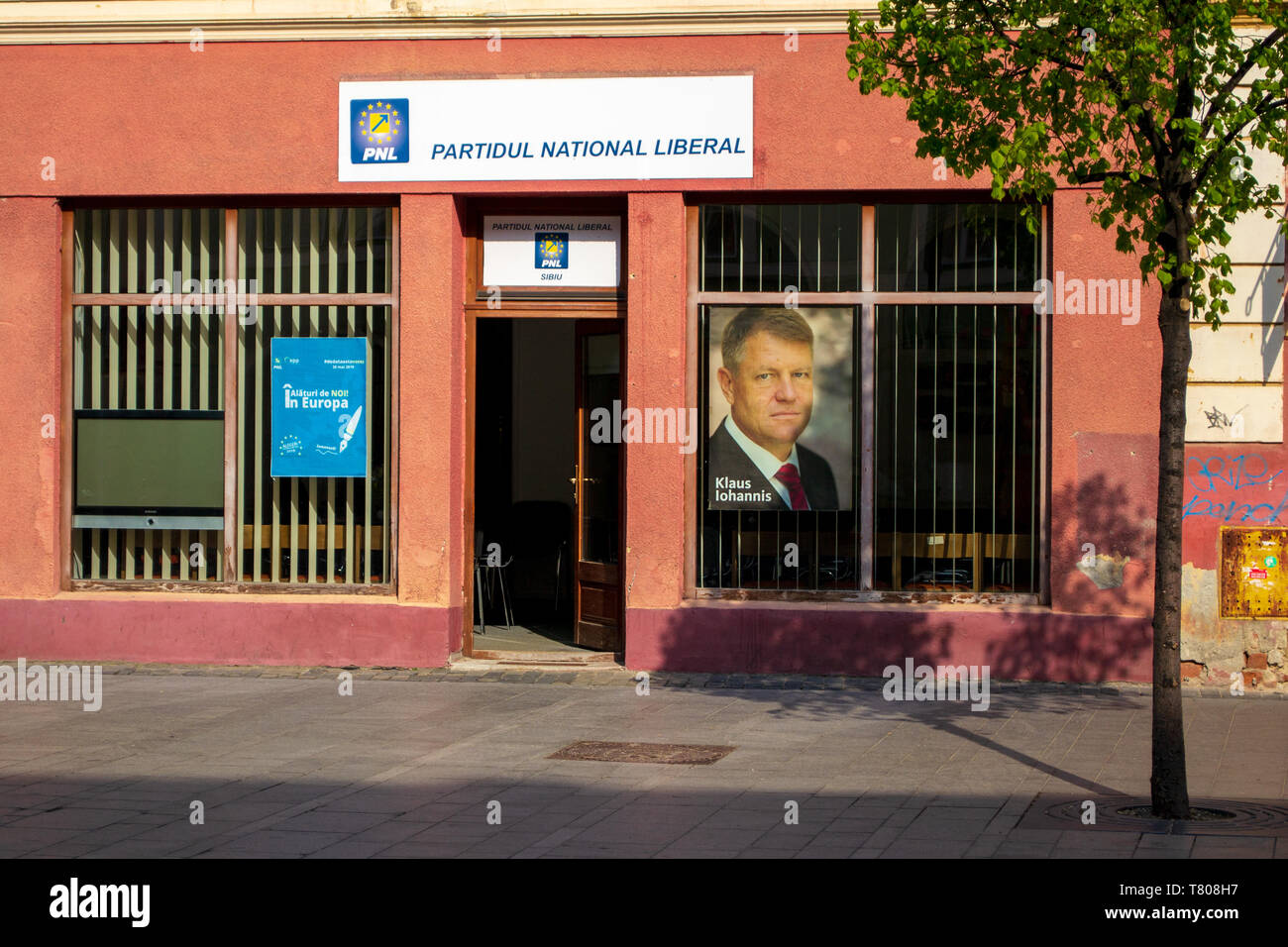 Sibiu, Romania - April 21, 2019: PNL Party (Partidul National Liberal, National Liberal Party) local office, with a picture of Klaus Werner Iohannis i Stock Photo