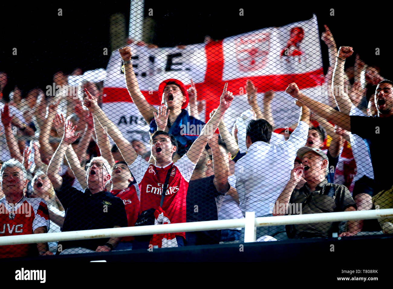 Arsenal fans celebrate in the stands during the UEFA Europa League