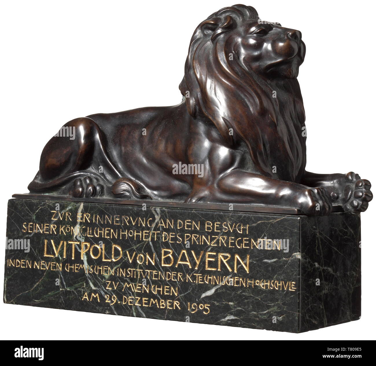Prince Regent Luitpold of Bavaria (1821 - 1912) - a bronze lion. A reclining bronze lion on a marble base with inscription. The artist's signature on the plinth. With an inscription on the front commemorating a visit by the Prince Regent to the Munich Institute of Technology in 1905. Dimensions 20 x 17 x 7 cm. Georg Albertshofer (1864 - 1933) was a professor at the Munich Academy and created famous sculptures and statues. The bronze figure was a gift to the Bavarian royal house. Direct from the possessions of the Bavarian ruling family. historic,, Additional-Rights-Clearance-Info-Not-Available Stock Photo