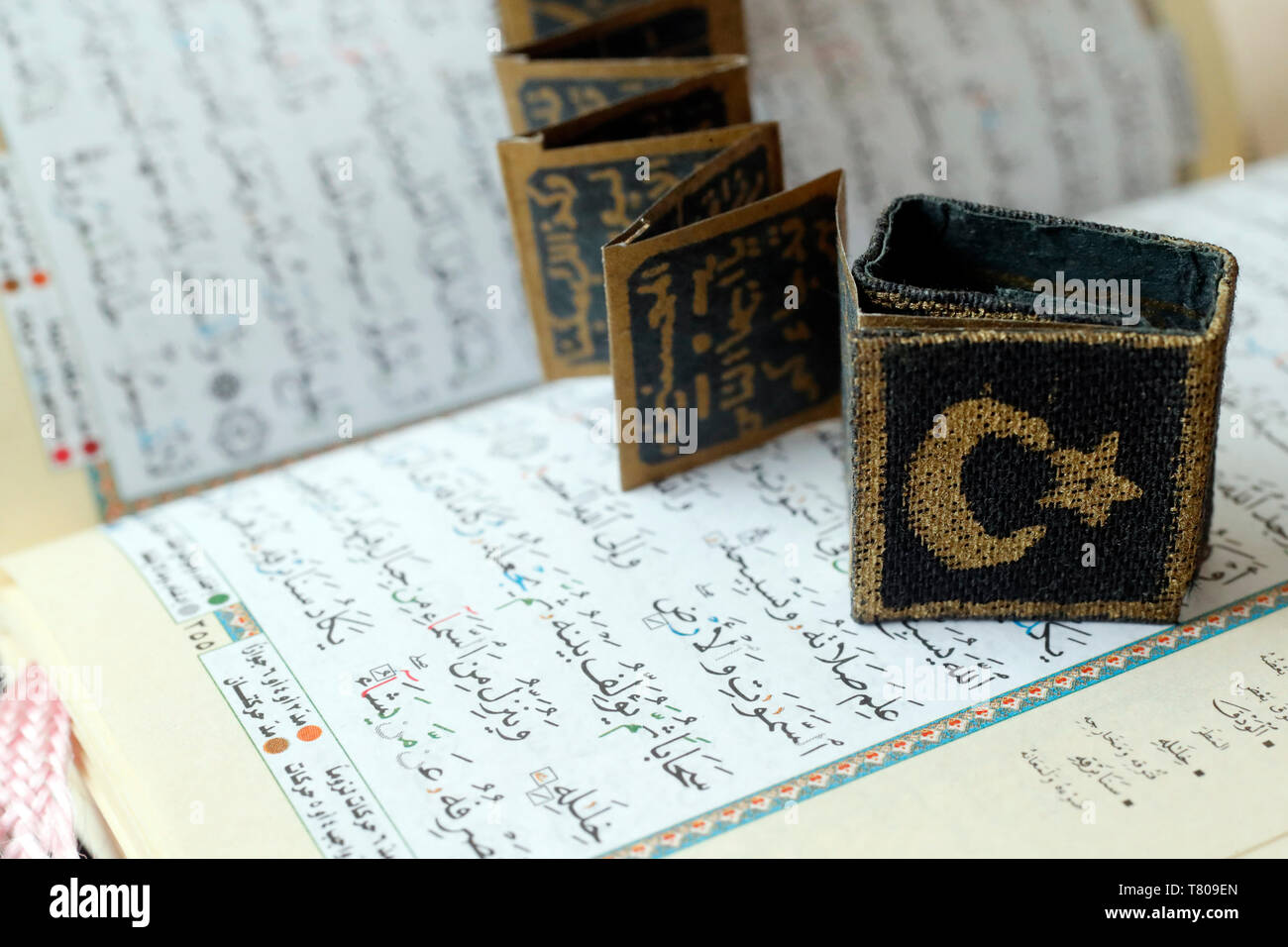 Close-up of Quran, crescent, star and surats, Muslim symbols, Vietnam, Indochina, Southeast Asia, Asia Stock Photo