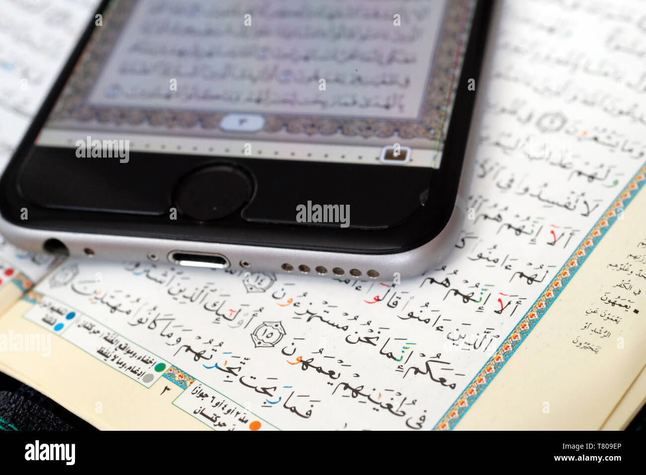 Digital Quran on a smartphone and Holy Quran book, Vietnam, Indochina, Southeast Asia, Asia Stock Photo