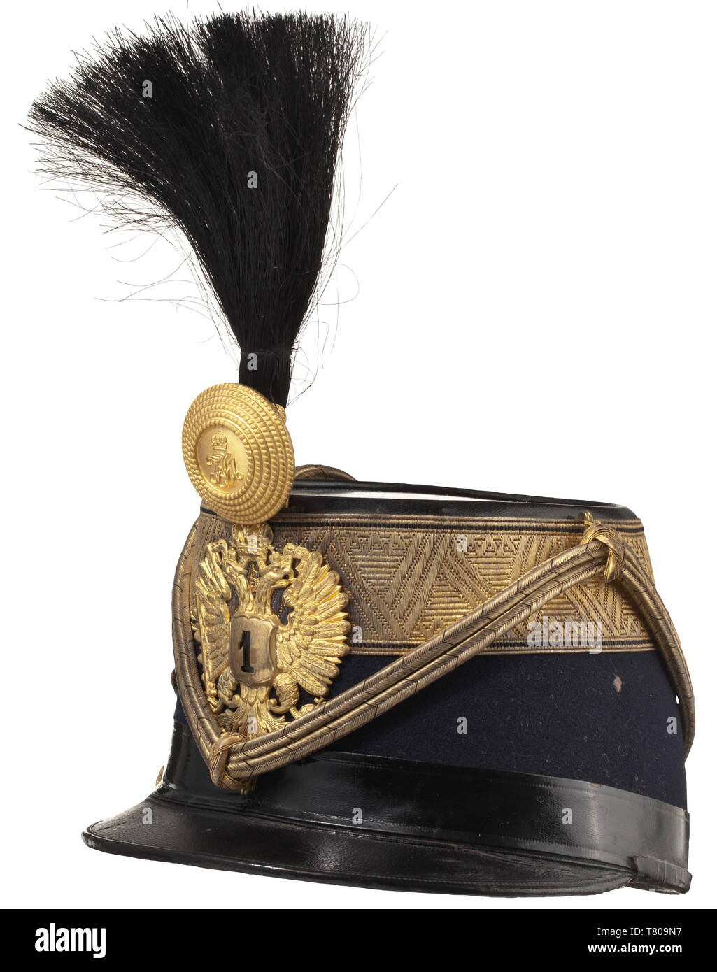 Otto von Habsburg (1912 - 2011) - a shako as Colonel of the Royal and Imperial Hussar Regiment no. 1 The body of dark blue (the regimental colour) cloth with wide gold edges, the double-headed eagle with '1' coat of arms, black horsehair bush, fire-gilt metal rose with initials 'FJ I', the 'Vitéz-Kötés' in finest issue with massively embroidered initials and double-headed eagle. The interior with a fine white silk liner and a crowned 'O' stamped in gold, black patent leather chin strap. The shako was a gift from Hussar Regiment no. 1, of the high, Additional-Rights-Clearance-Info-Not-Available Stock Photo