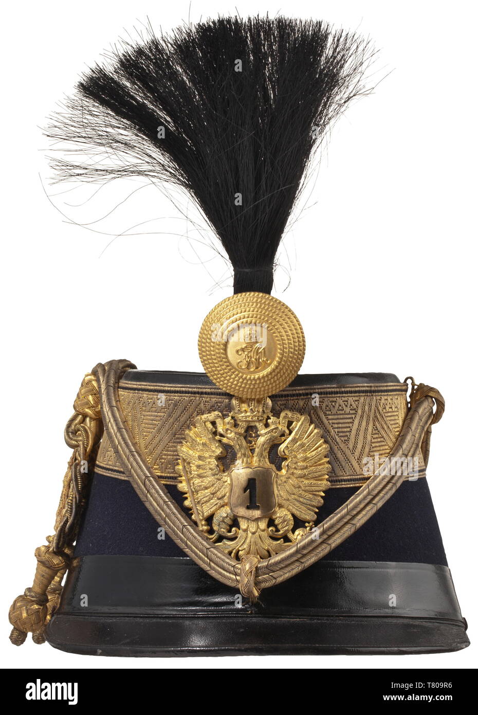 Otto von Habsburg (1912 - 2011) - a shako as Colonel of the Royal and Imperial Hussar Regiment no. 1 The body of dark blue (the regimental colour) cloth with wide gold edges, the double-headed eagle with '1' coat of arms, black horsehair bush, fire-gilt metal rose with initials 'FJ I', the 'Vitéz-Kötés' in finest issue with massively embroidered initials and double-headed eagle. The interior with a fine white silk liner and a crowned 'O' stamped in gold, black patent leather chin strap. The shako was a gift from Hussar Regiment no. 1, of the high, Additional-Rights-Clearance-Info-Not-Available Stock Photo