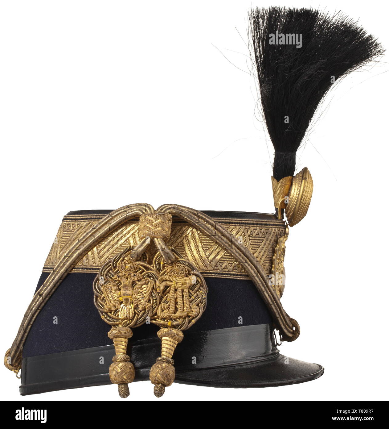 Otto von Habsburg (1912 - 2011) - a shako as Colonel of the Royal and Imperial Hussar Regiment no. 1 The body of dark blue (the regimental colour) cloth with wide gold edges, the double-headed eagle with '1' coat of arms, black horsehair bush, fire-gilt metal rose with initials 'FJ I', the 'Vitéz-Kötés' in finest issue with massively embroidered initials and double-headed eagle. The interior with a fine white silk liner and a crowned 'O' stamped in gold, black patent leather chin strap. The shako was a gift from Hussar Regiment no. 1, of the high, Additional-Rights-Clearance-Info-Not-Available Stock Photo