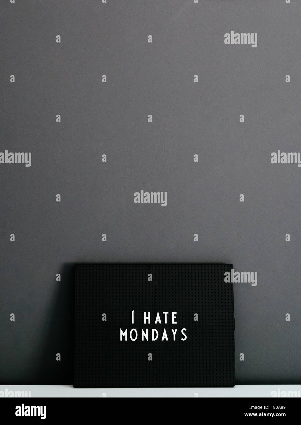 'I Hate Mondays' written in white on a black board Stock Photo