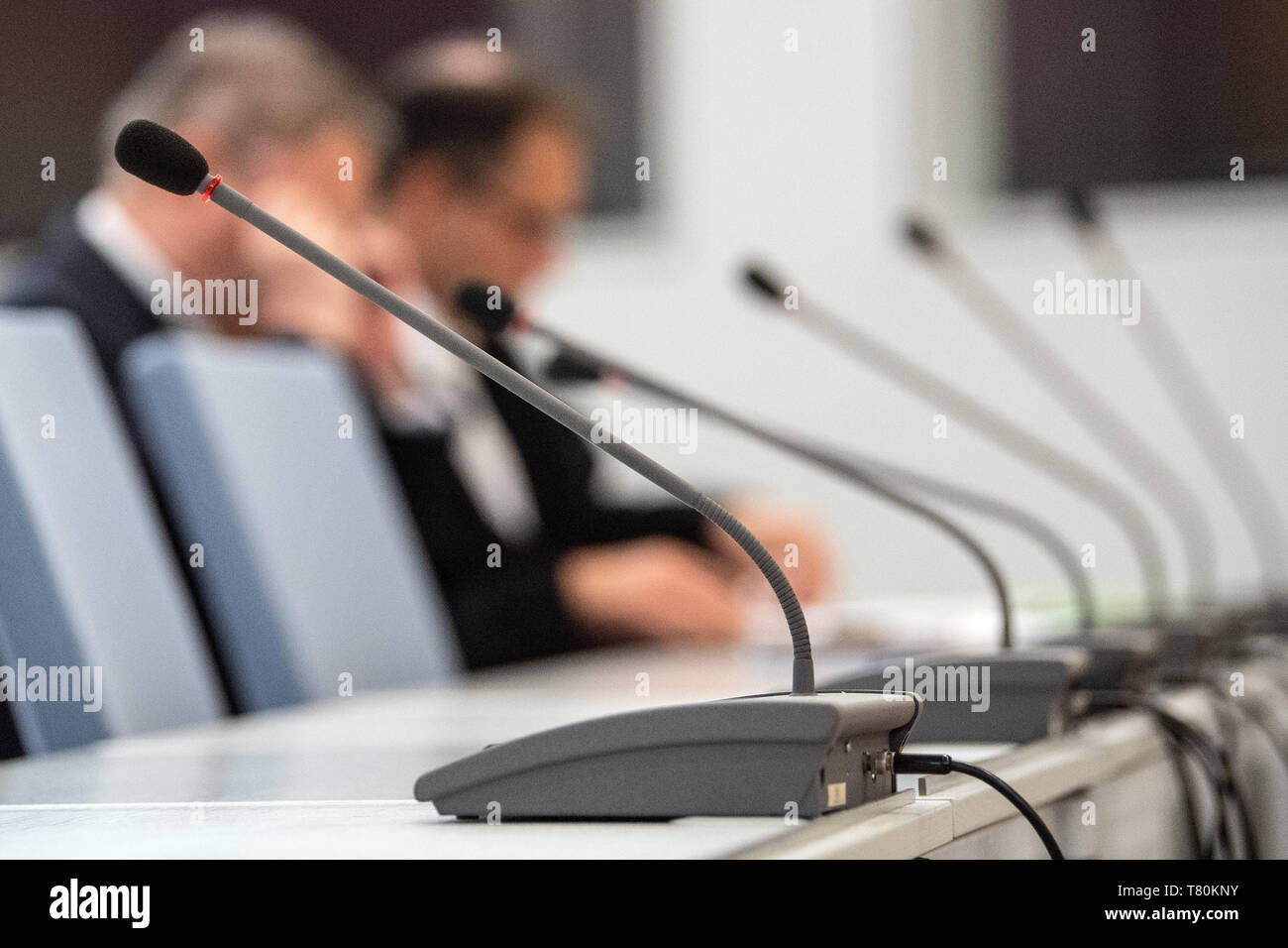 10 May 2019, North Rhine-Westphalia, Duesseldorf: A defendant (l) accused of revealing state secrets waits with his lawyer Andre Neumann (r) for the trial to begin. Two employees of the defence industry are accused. They are said to have internally disseminated a secret document of the Ministry of Defense. Photo: Federico Gambarini/dpa Stock Photo