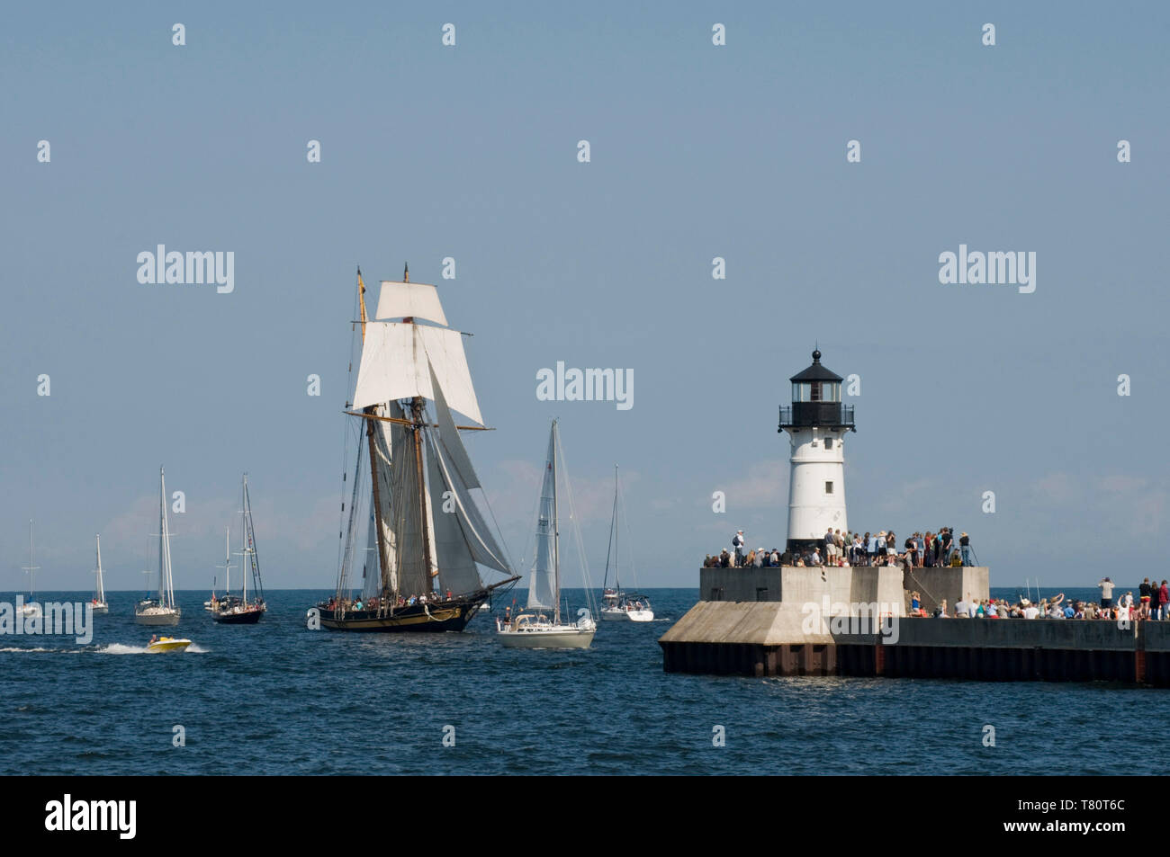 Duluth, Minnesota. Spectators watch as one of three tall ships enters