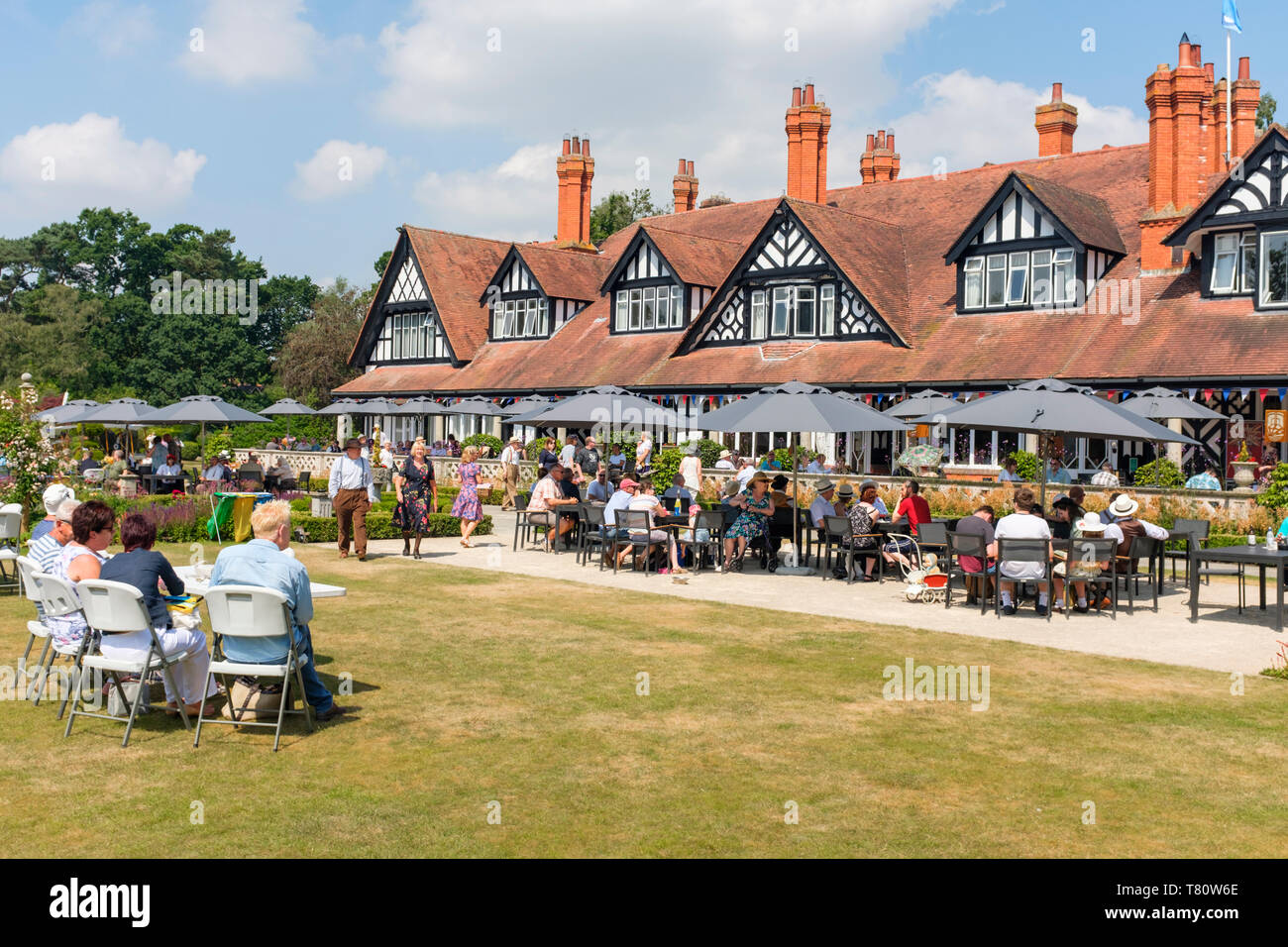 Woodhall Spa 1940s weekend. People sitting outside enjoying the hot