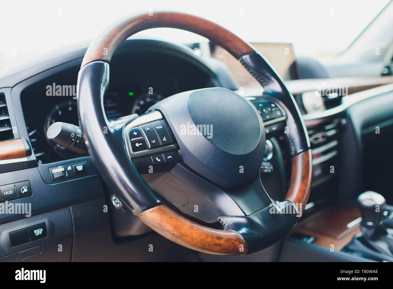 Luxury car interior. Steering wheel, shift lever and dashboard Stock ...