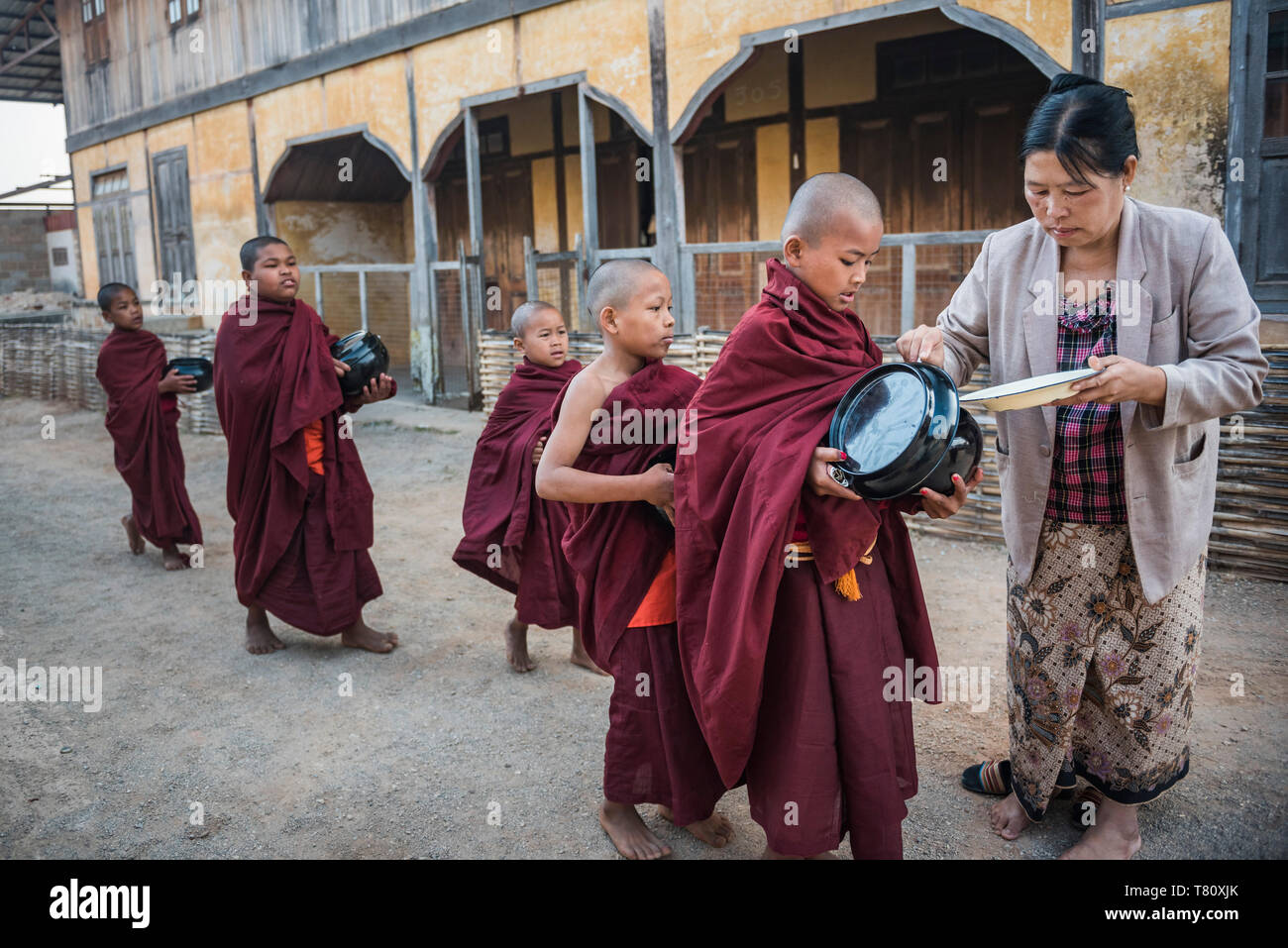 Young novice monks collecting alms at Pindaya, Shan State, Myanmar (Burma), Asia Stock Photo