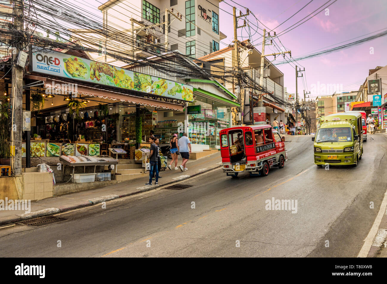A street scene and local taxis and tuk tuks in Kata, Phuket, Thailand, Southeast Asia, Asia Stock Photo