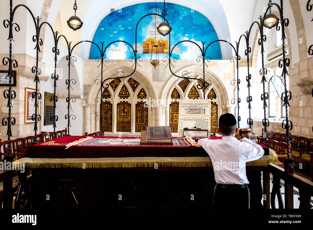 Boy reading at the teva, the four Sephardic Synagogues, Jerusalem old city, Israel, Middle East Stock Photo
