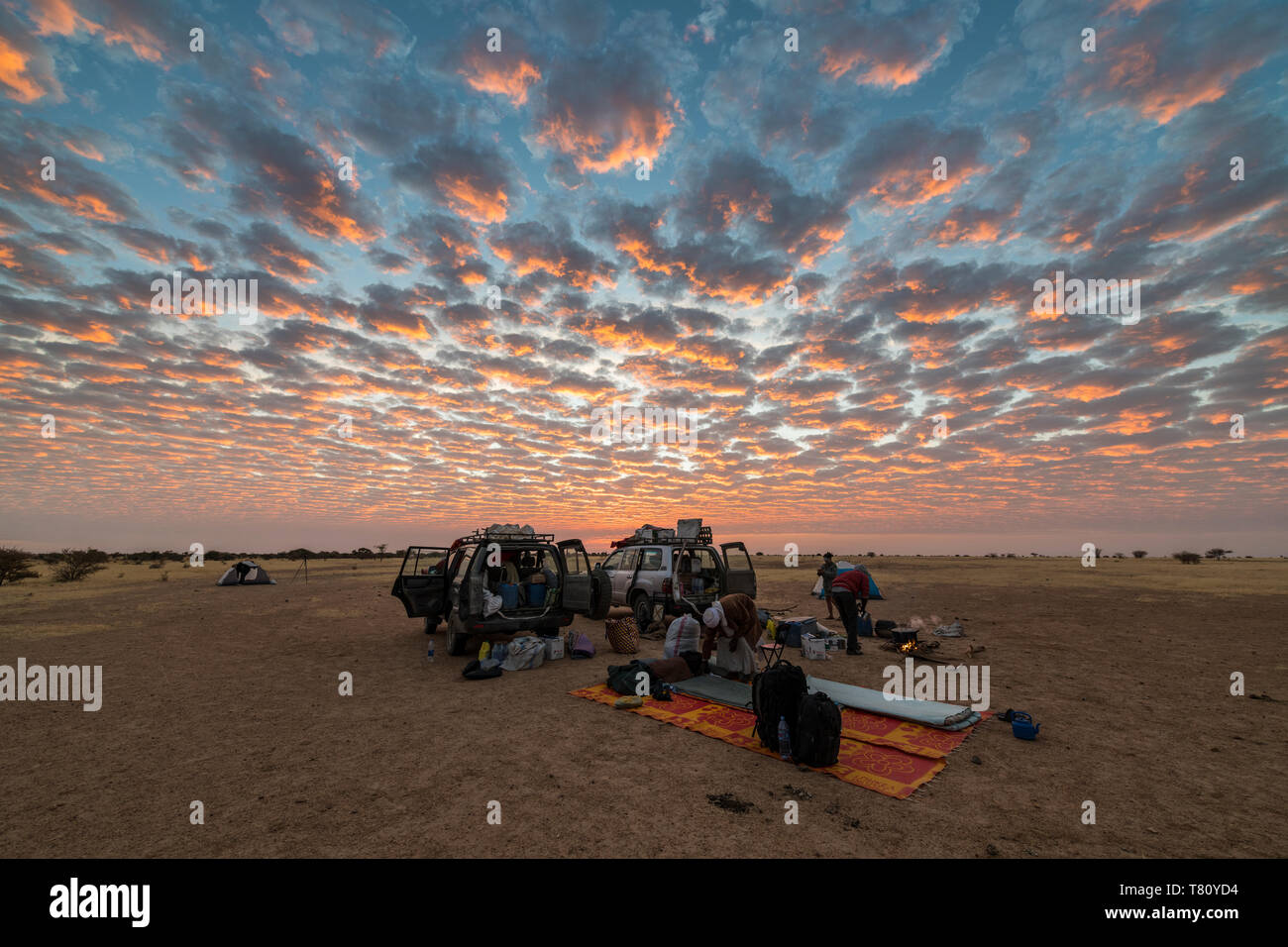 Camping under a dramatic morning sky in the Sahel, Chad, Africa Stock Photo