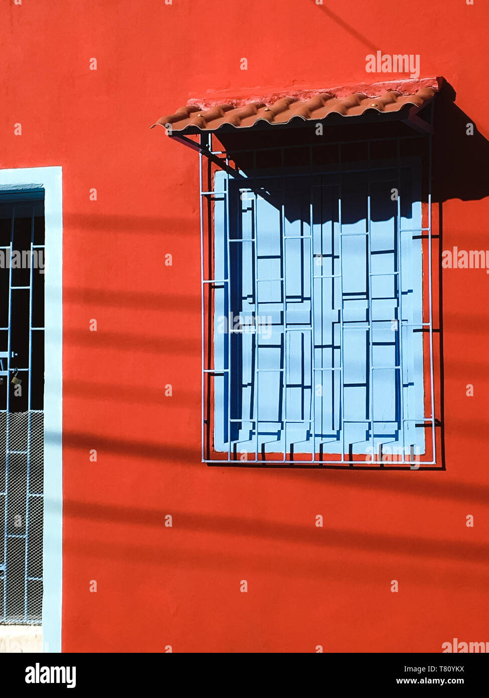 Red house with blue window, Cartagena, Colombia, South America Stock Photo