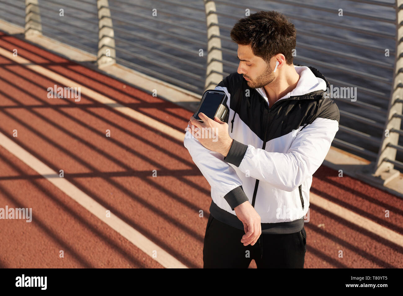 Sportsman with smartphone Stock Photo
