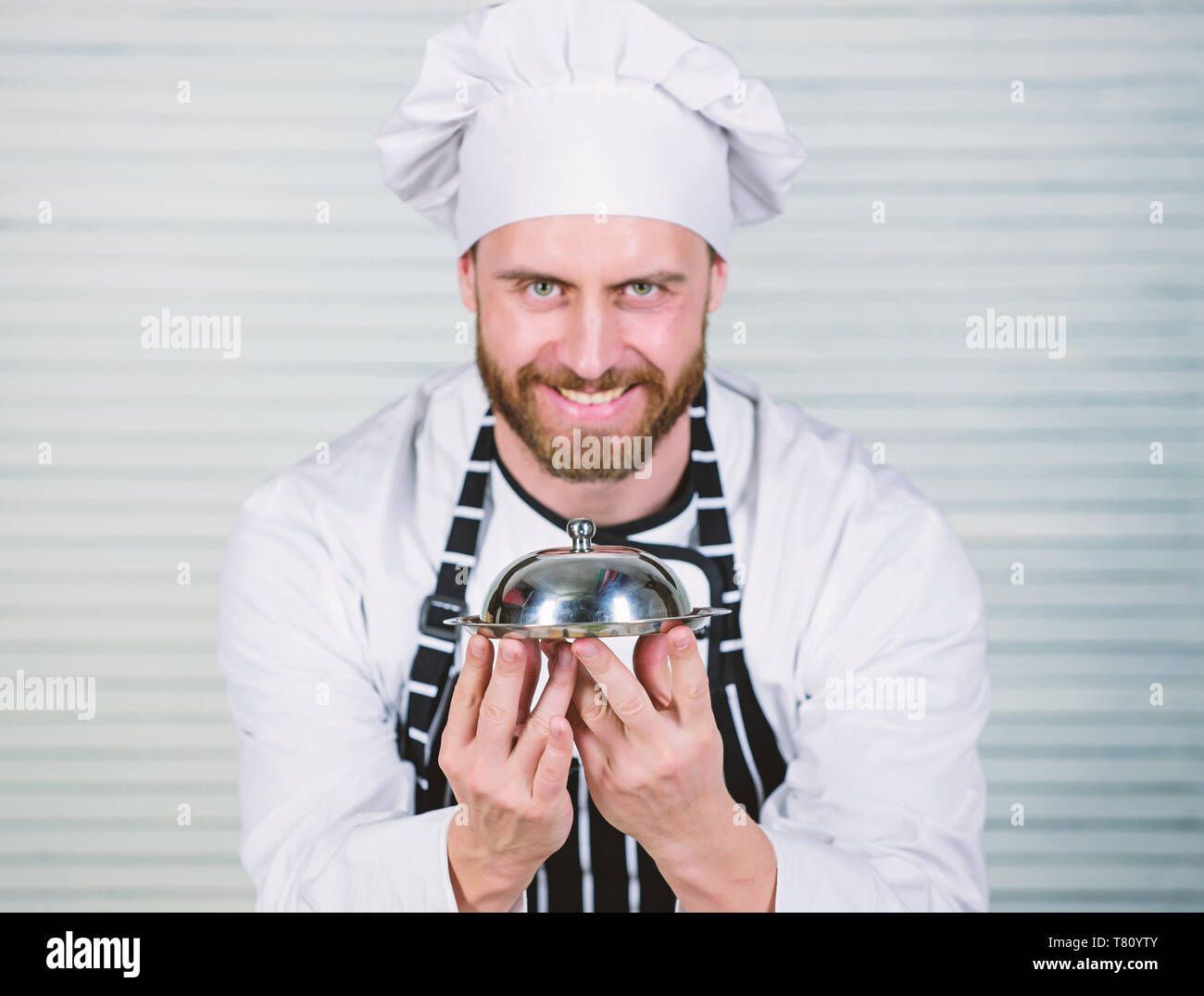 Head Cook Handsome Man In Apron And Cook Hat Chef Cook In Uniform Standing With Delicious Dish 