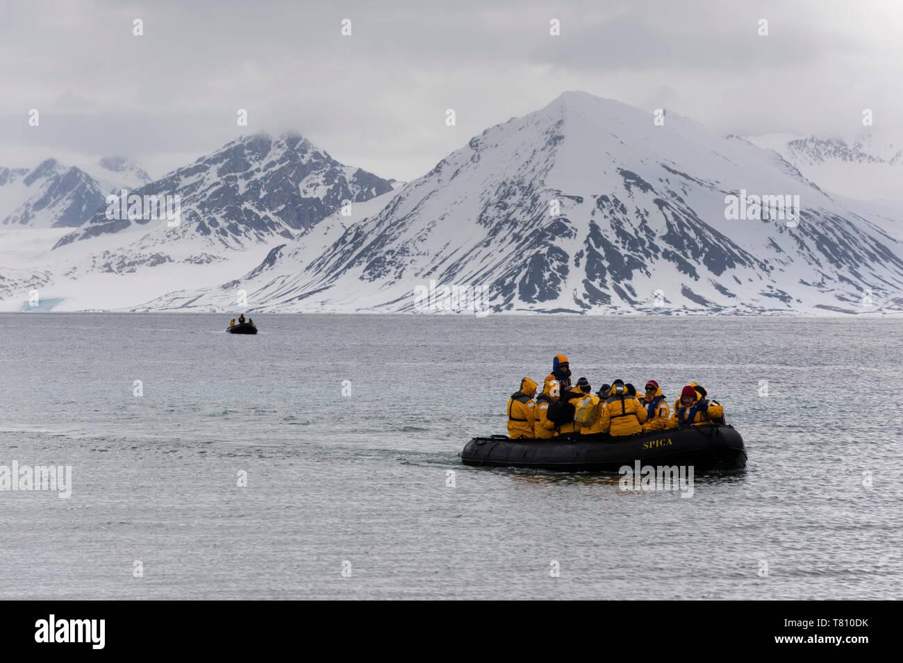 Tourist landing on a beach of Smeerenburg Fjord, Amsterdamoya, Spitsbergen, Svalbard Islands, Arctic, Norway, Europe Stock Photo