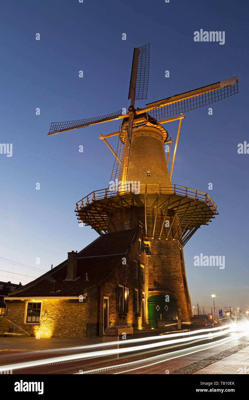 Light streaks by the Molen de Roos, a windmill in Delft, South Holland, The Netherlands, Europe Stock Photo