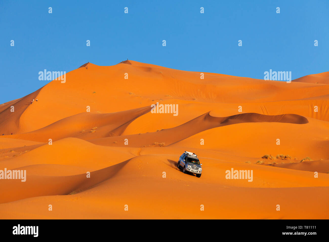 Off-Road Vehicle driving on sand dunes, Erg Chebbi, Sahara Desert ...