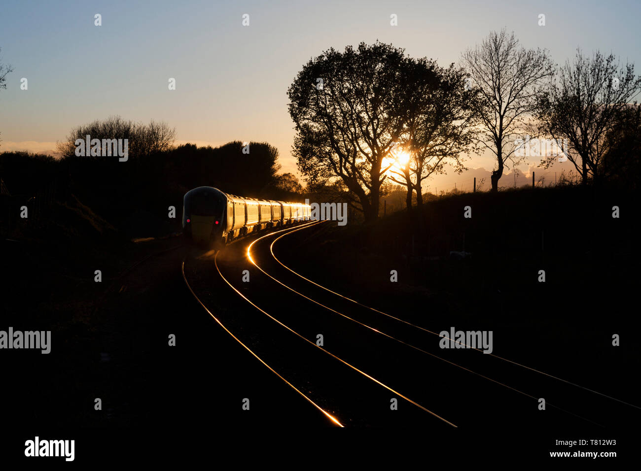 2 First Great Western railway Hitachi Intercity Express trains  ( IEP ) head into the sunset at Crofton, Wiltshire Stock Photo