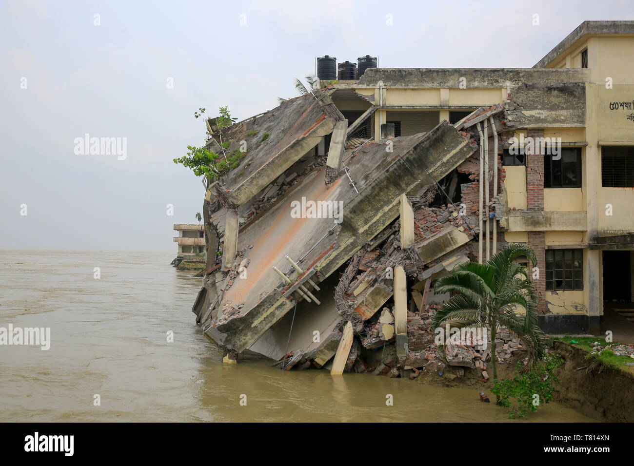 Naria Upazila Health Complex building in Shariatpur district goes into the Padma River. Shariatpur, Bangladesh Stock Photo