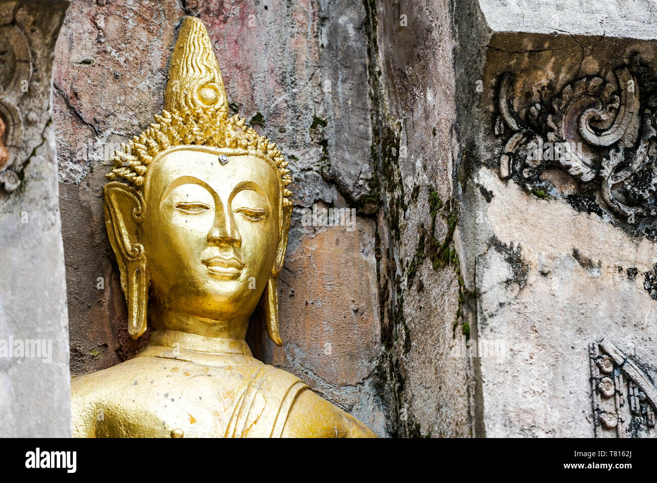 Great Gold Buddha statue with old background wall Stock Photo - Alamy