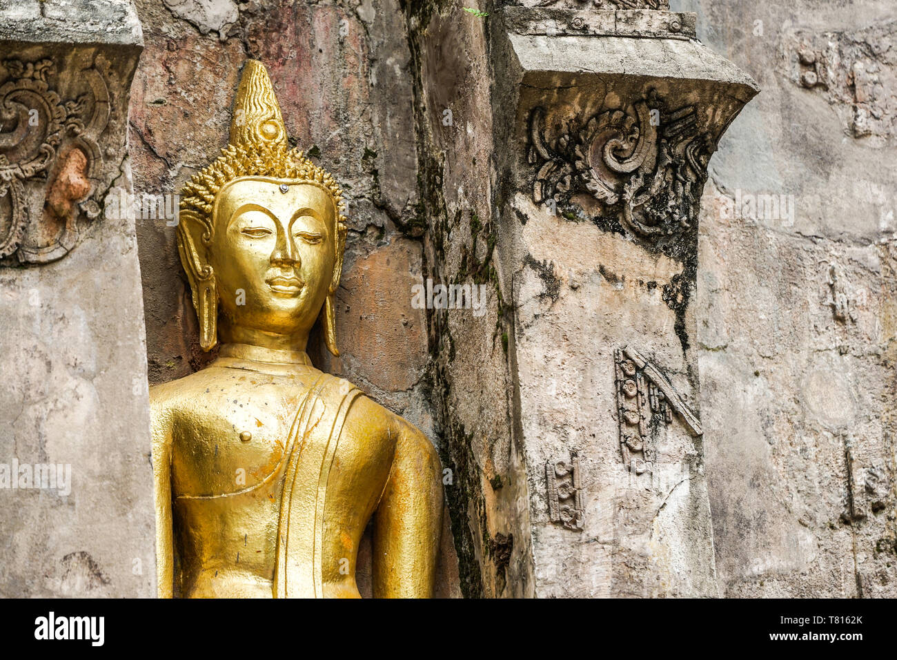 Great Gold Buddha statue with old background wall Stock Photo - Alamy