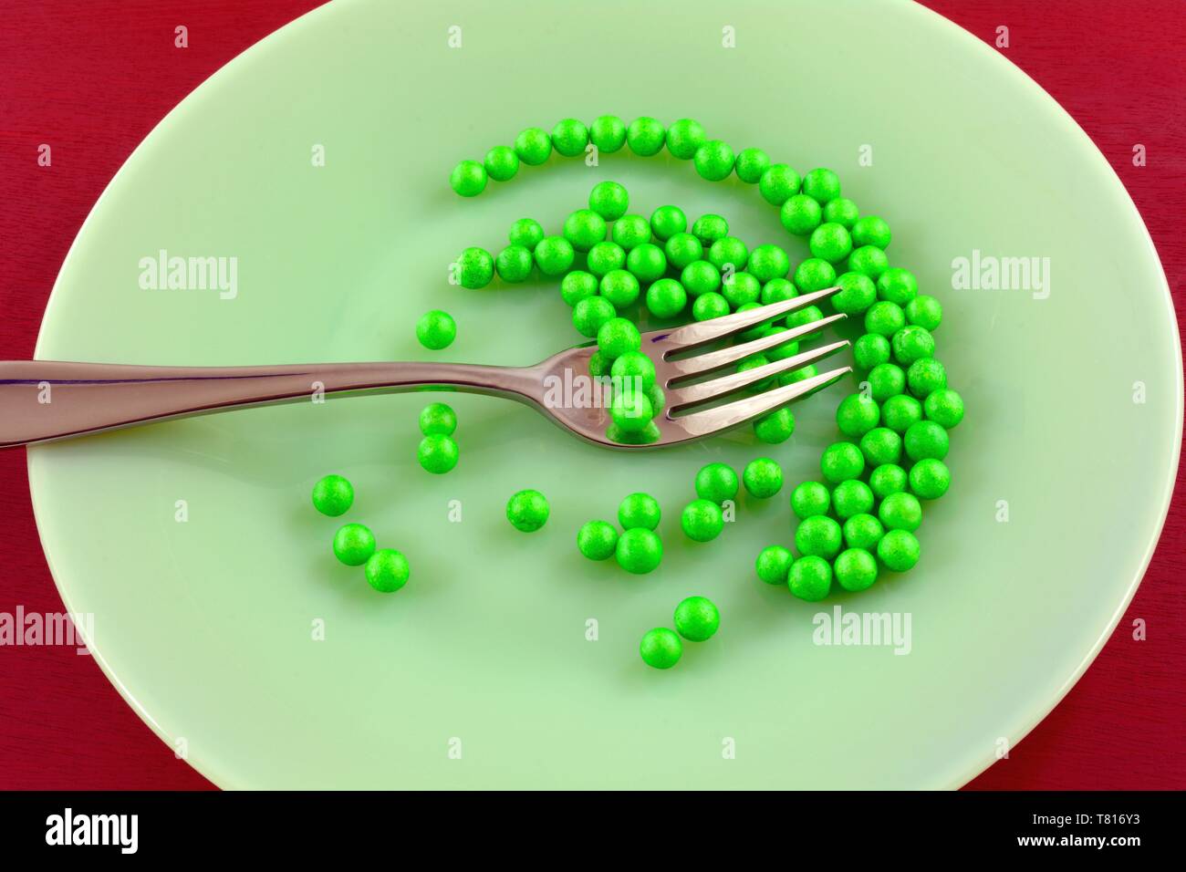 Humorous anti-diet anti-food gluten free, dairy and meat free, fat-free, calorie-free, sugar-free, vegetable-free meal of polystyrene balls with fork Stock Photo