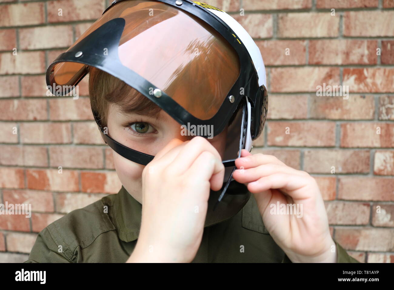 Child dressing up as a fighter pilot for Halloween Stock Photo