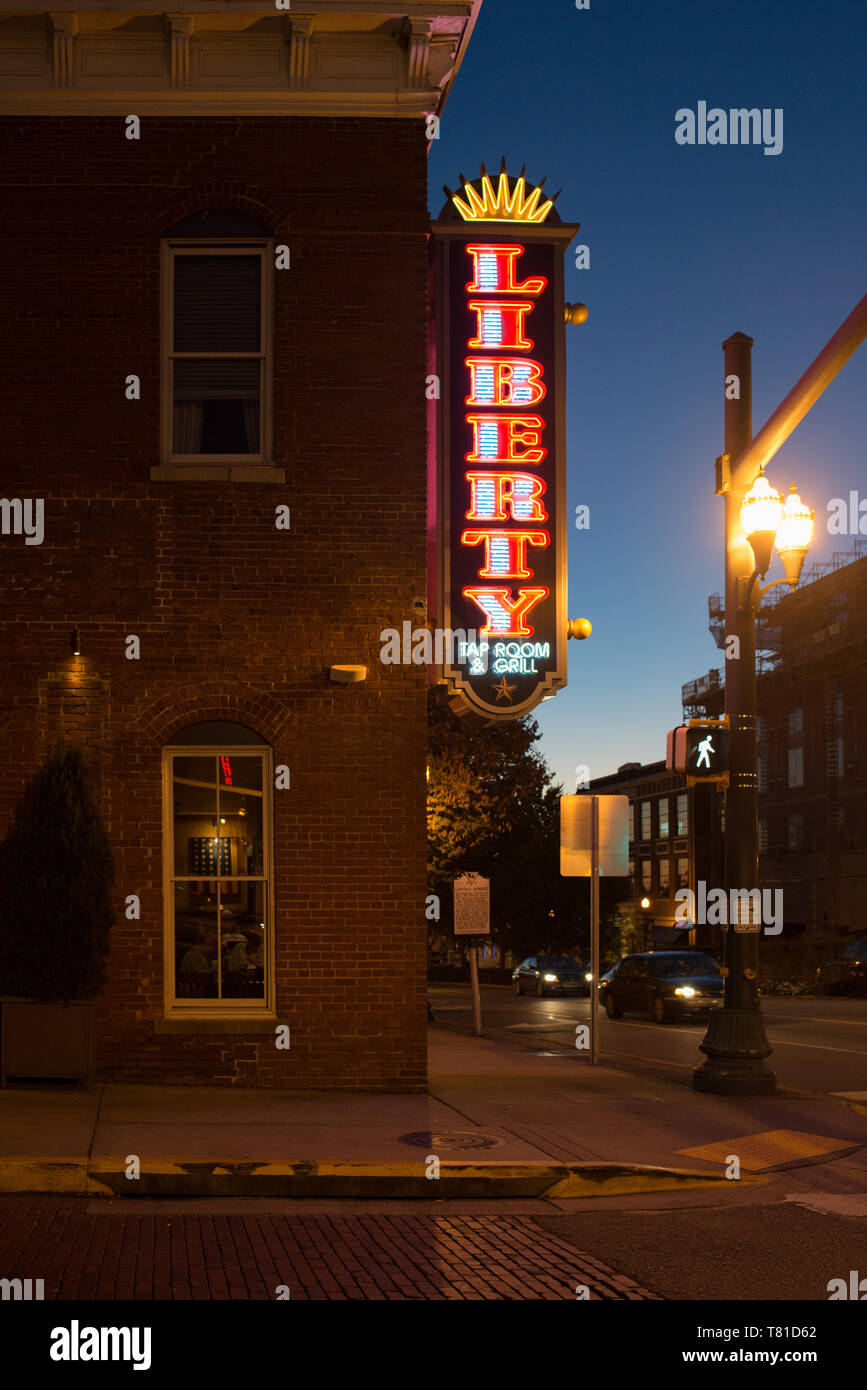 A Neon Sign Advertises One Restaurant Liberty In The